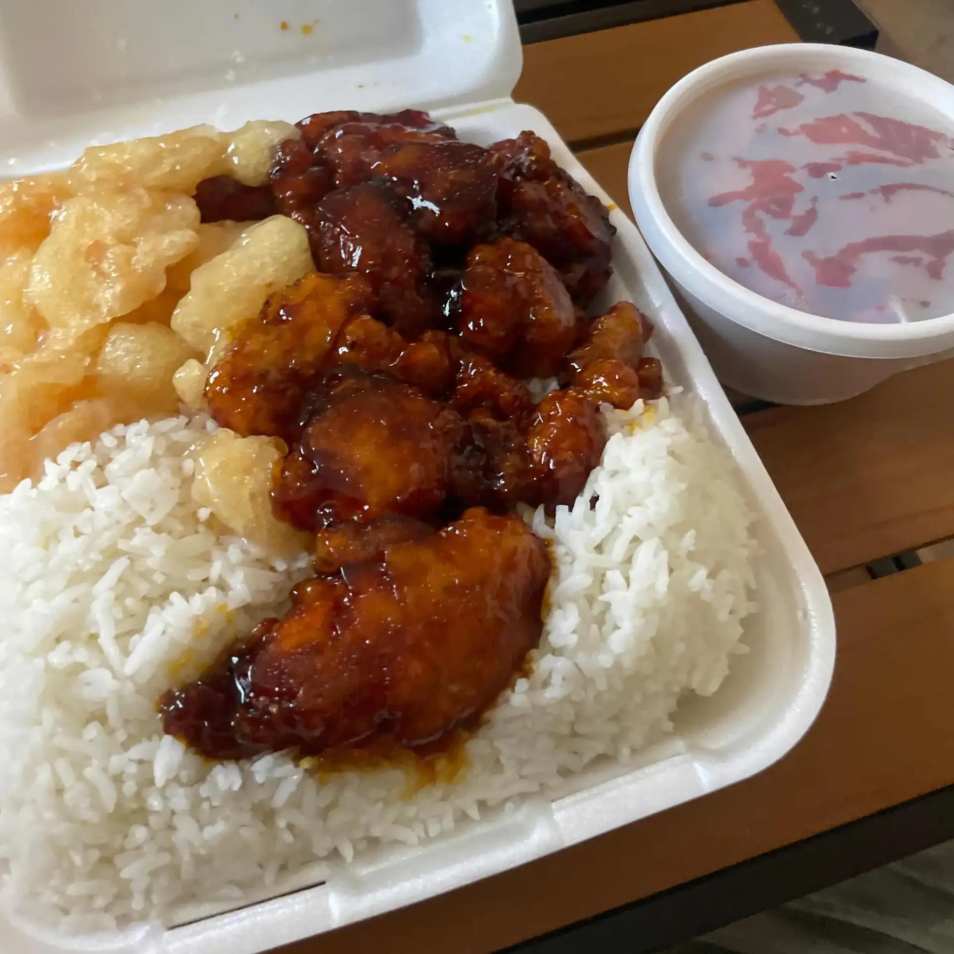 Sweet and sour chicken served with rice and egg roll at Aloha Wok & Grill BBQ, a Asian Fusion Restaurant in Fullerton